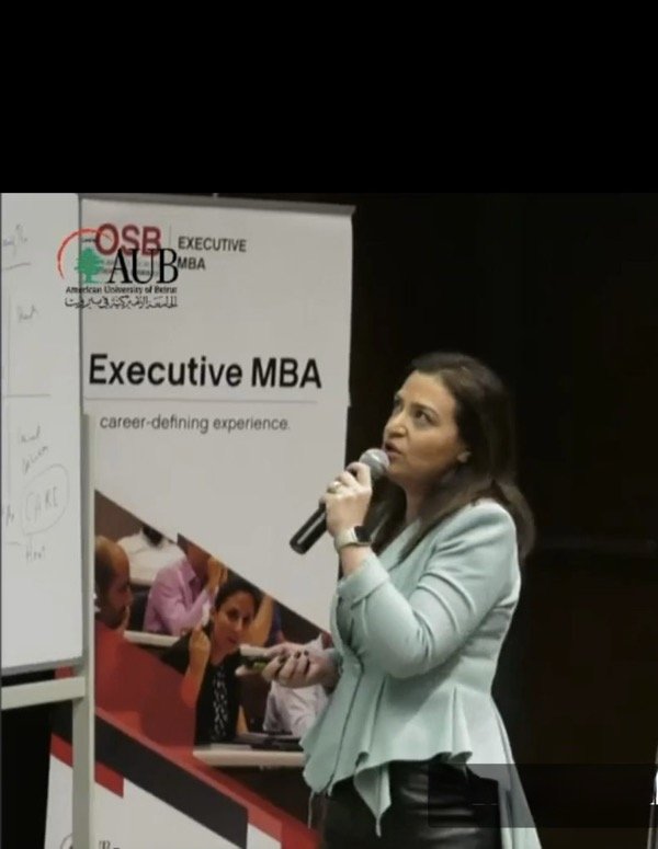 Hala Achkar Slaiby presenting on an Executive MBA program at the American University of Beirut.